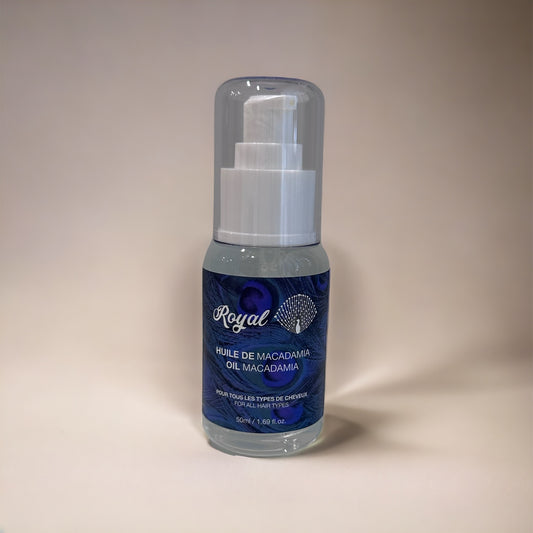 A bottle of Royal Hydrating Hair Oil, designed to deeply nourish and moisturize hair, leaving it soft, shiny, and healthy.