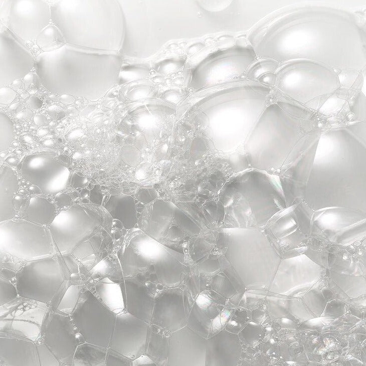 Close-up of rich foam created by Royal Hydrating Shampoo, demonstrating its creamy texture and gentle cleansing properties for soft, nourished, and healthy hair.