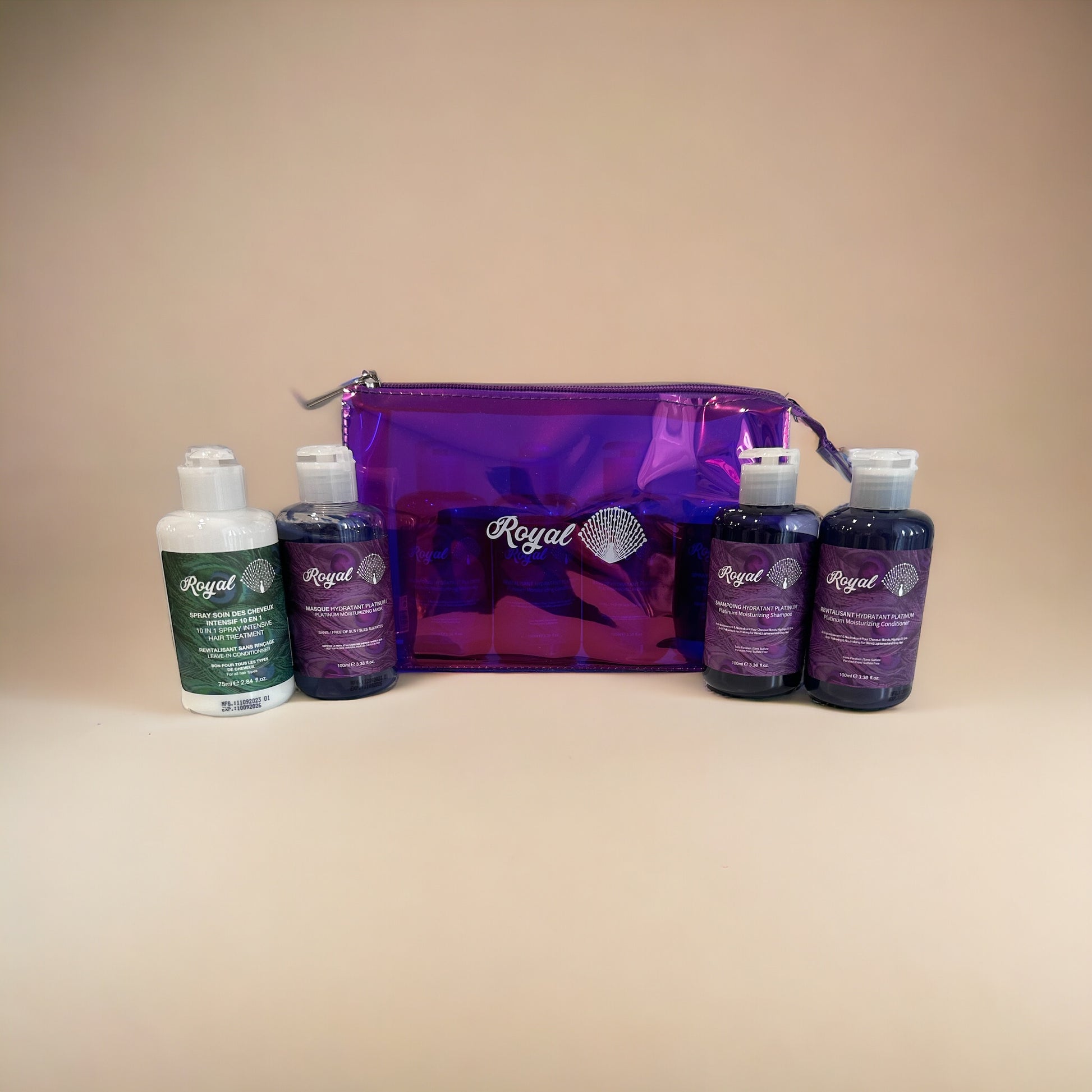 Royal Platinum Travel Set products removed from packaging, including 100ml shampoo, 100ml conditioner, 100ml hair mask, and 75ml leave-in conditioner, designed to deeply hydrate, nourish, and smooth hair while on the go.