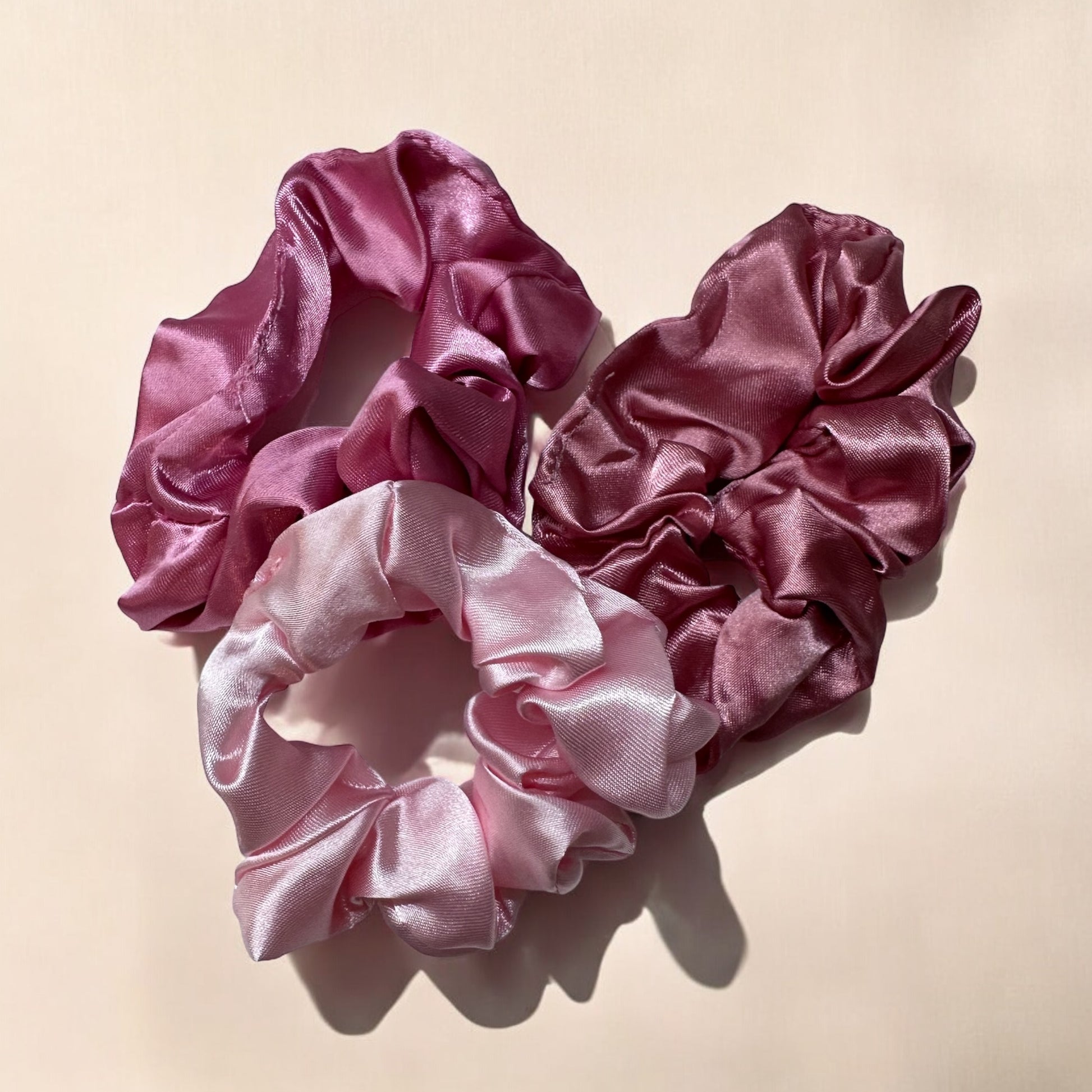 Set of 3 Royal satin hair scrunchies in pink, designed to gently hold hair without causing breakage or creases, while adding a stylish touch.