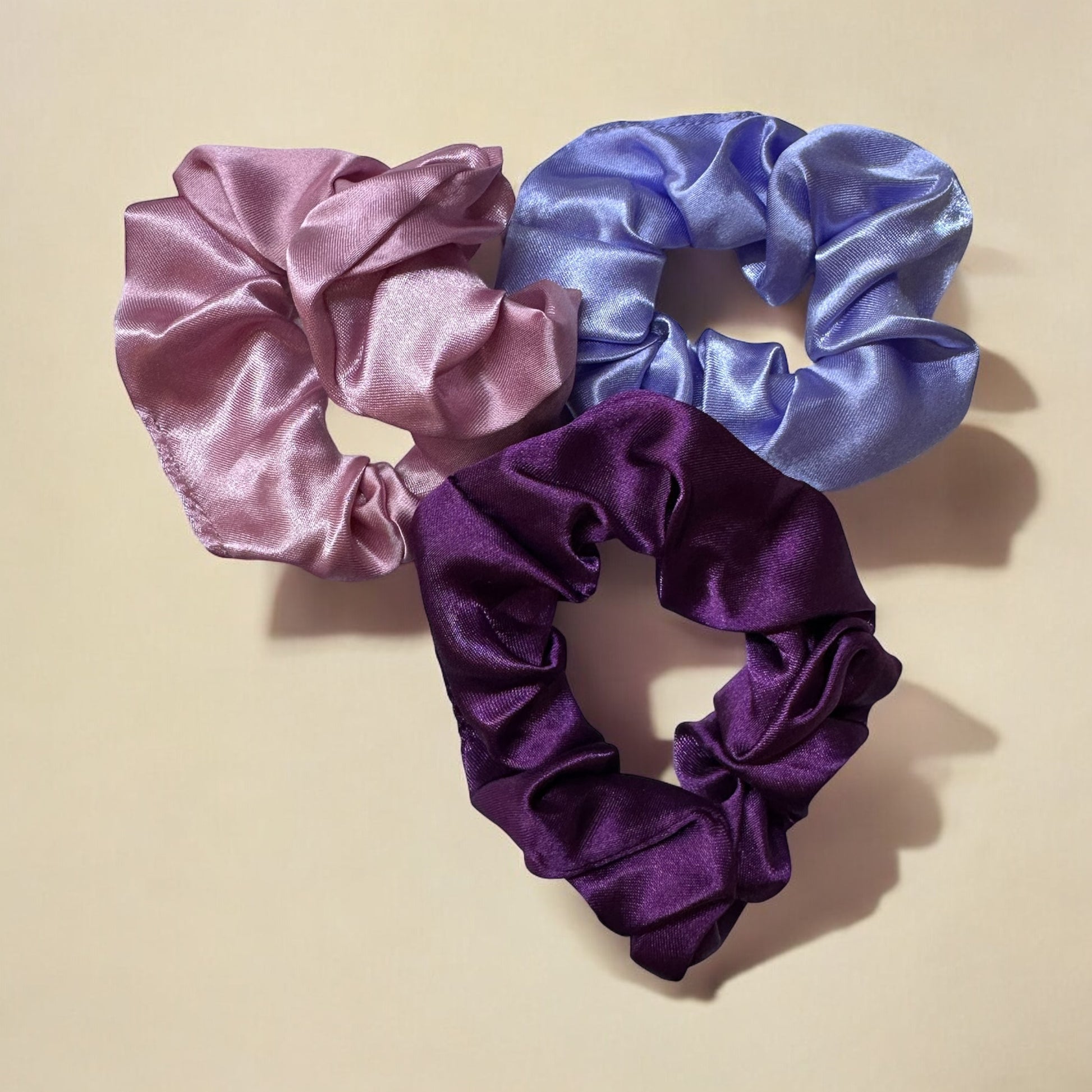 Set of 3 Royal satin hair scrunchies in purple, designed to gently hold hair without causing breakage or creases, while adding a stylish touch.