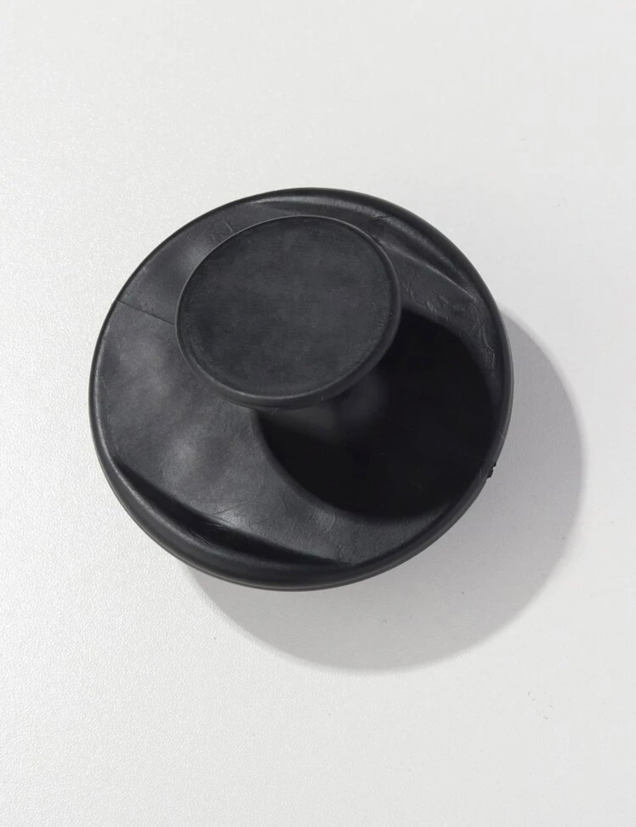 Side view of the Royal black scalp massage brush, showing its ergonomic handle and flexible bristles for comfortable and effective scalp stimulation.