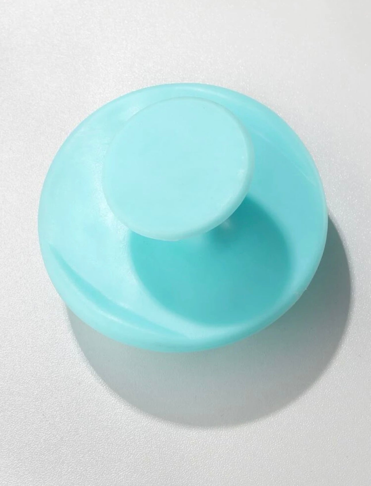 Royal blue scalp massage brush, designed to gently stimulate the scalp, improve blood circulation, and promote healthy hair growth.