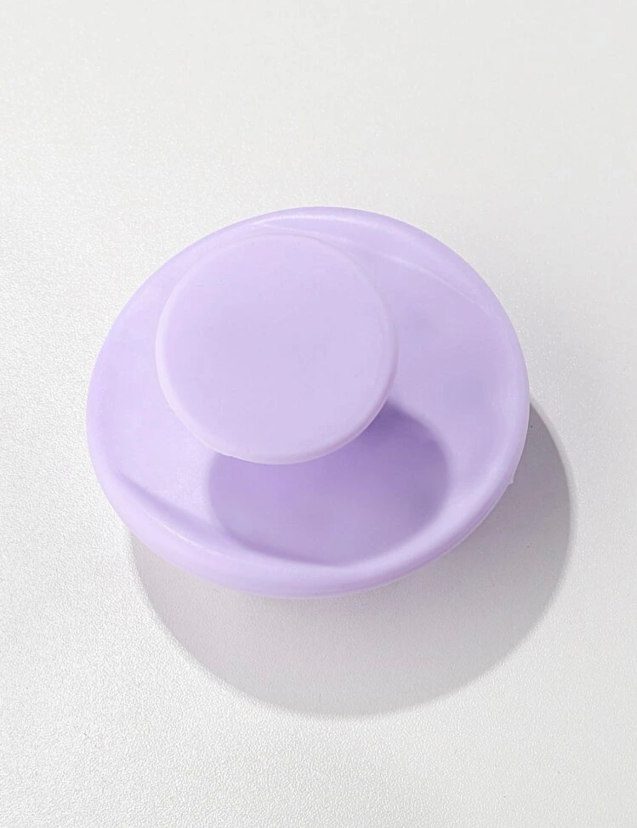 Side view of the Royal purple scalp massage brush, showing its ergonomic handle and flexible bristles for comfortable and effective scalp stimulation.